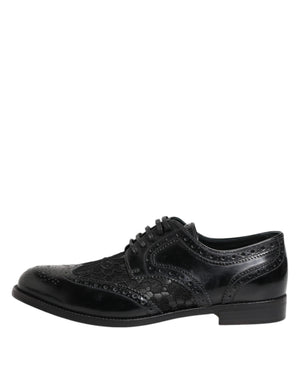 Dolce & Gabbana black leather formal lace-up shoe with intricate floral lace paneling and brogue detailing.