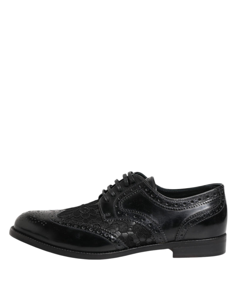 Dolce & Gabbana black leather formal lace-up shoe with intricate floral lace paneling and brogue detailing.