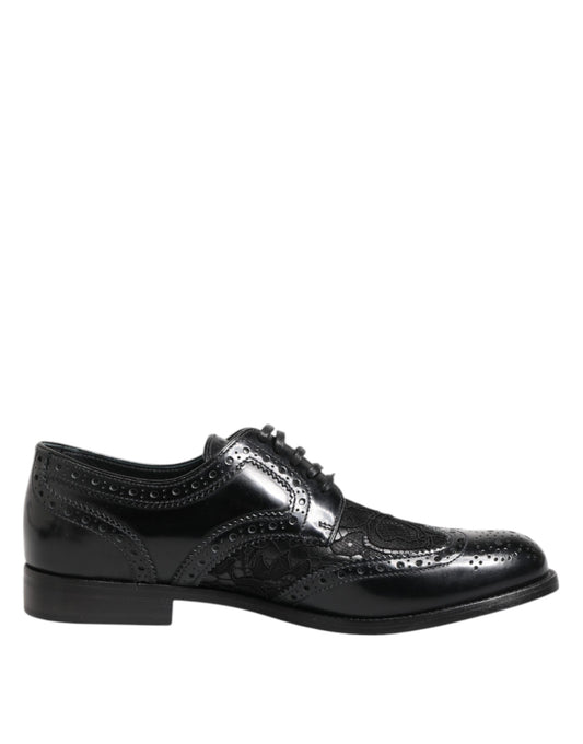 Dolce & Gabbana black leather and lace brogue dress shoe with perforated wingtip detailing and lace-up closure.
