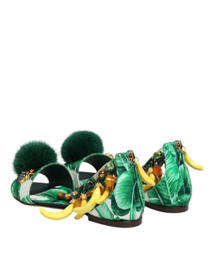 Green sandals with leaf pattern and yellow accents on a white background