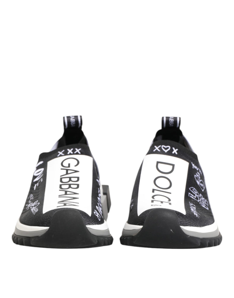 Dolce & Gabbana black and white Sorrento knit slip-on sneakers with white logo panels and graffiti-style detailing.