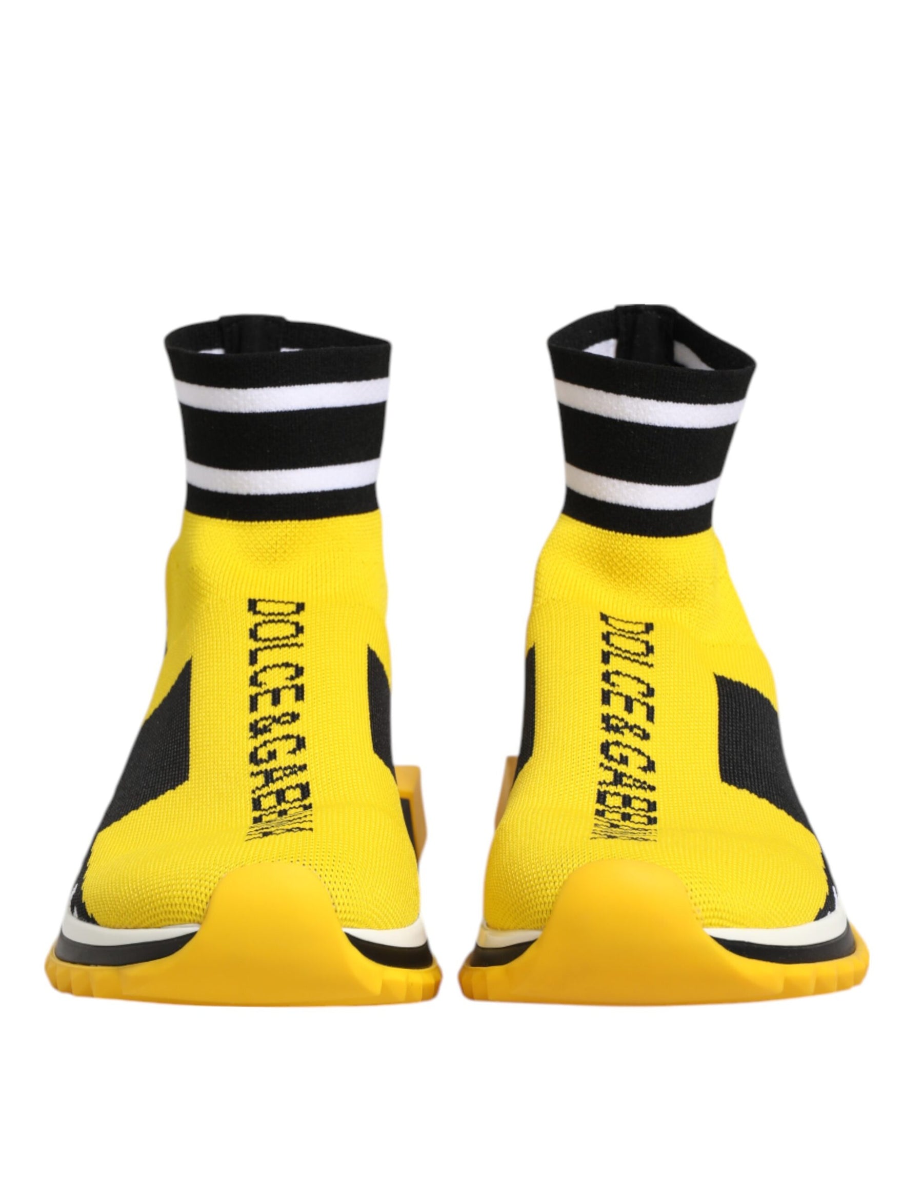 Dolce & Gabbana yellow and black knit sock sneakers with striped cuffs and vertical logo text on a yellow rubber sole.