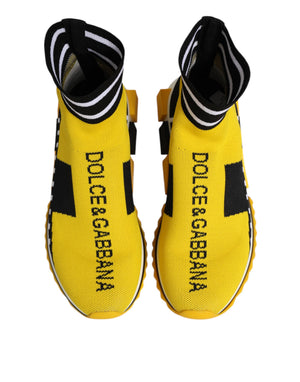 Dolce & Gabbana yellow and black knit sock sneakers with logo branding, striped cuffs, and chunky rubber soles.