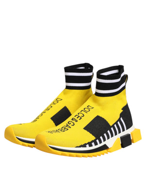 Dolce & Gabbana Sorrento slip-on sneakers in yellow and black knit with logo text and striped ankle cuffs.