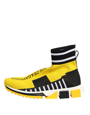 Dolce & Gabbana yellow and black knit sock sneaker with white striped trim and chunky yellow/white geometric sole.