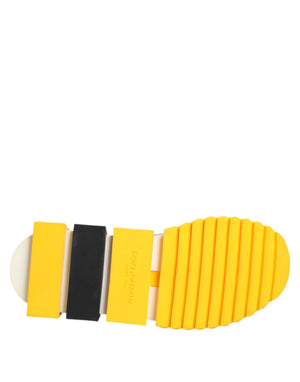 Dolce & Gabbana Sorrento sneaker sole featuring bright yellow, black, and white rubber segments with ribbed tread.