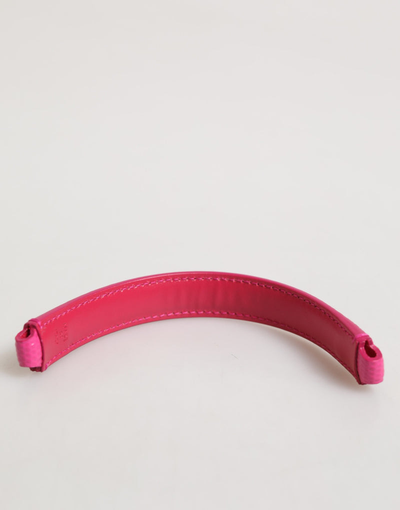 Bright pink leather curved handbag handle with stitched edges
