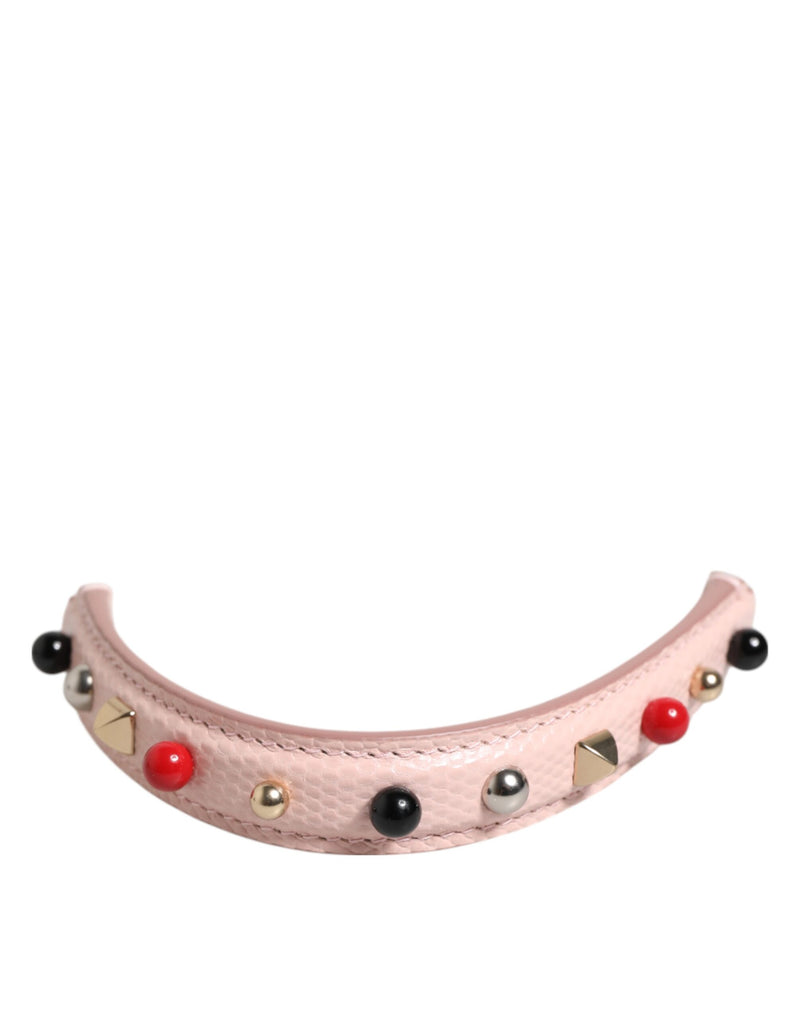 Light pink textured leather bag handle studded with colorful beads and metallic studs