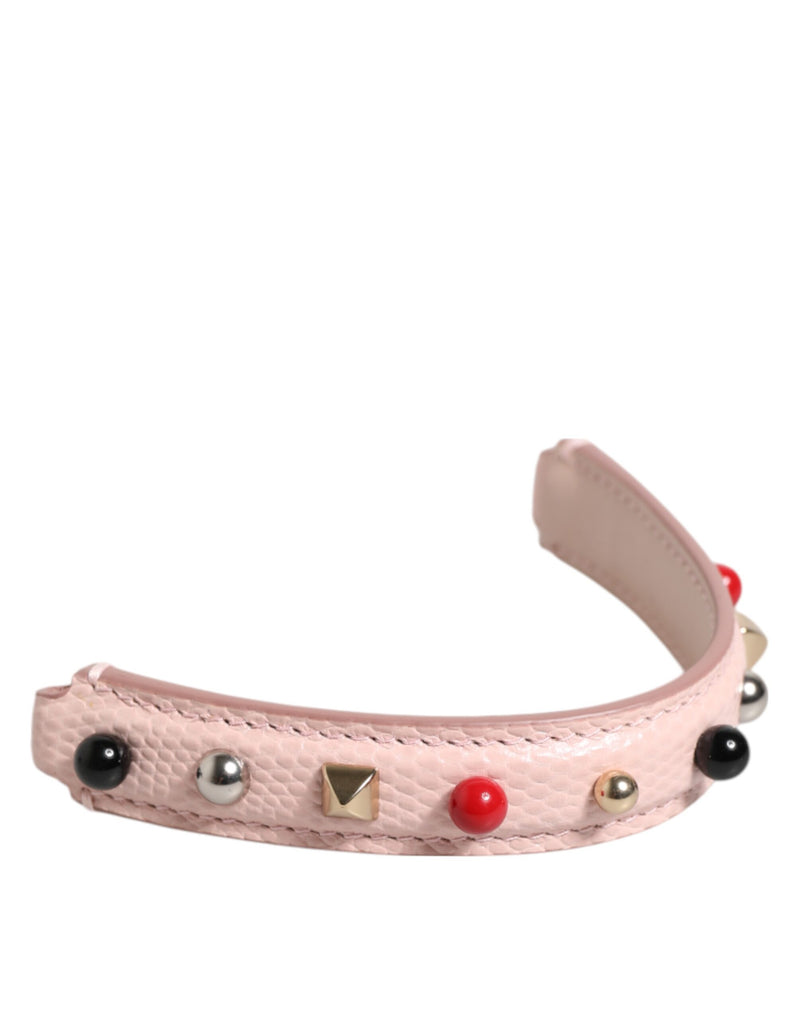 Light pink textured leather bag handle adorned with colorful studs and beads