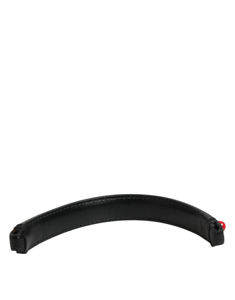 Black leather curved bag handle with red accent on the end