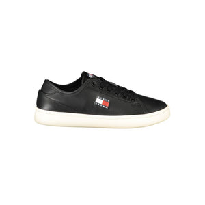 Tommy Hilfiger women's black polyurethane sneaker with lace-up closure, white sole, and side logo patch.