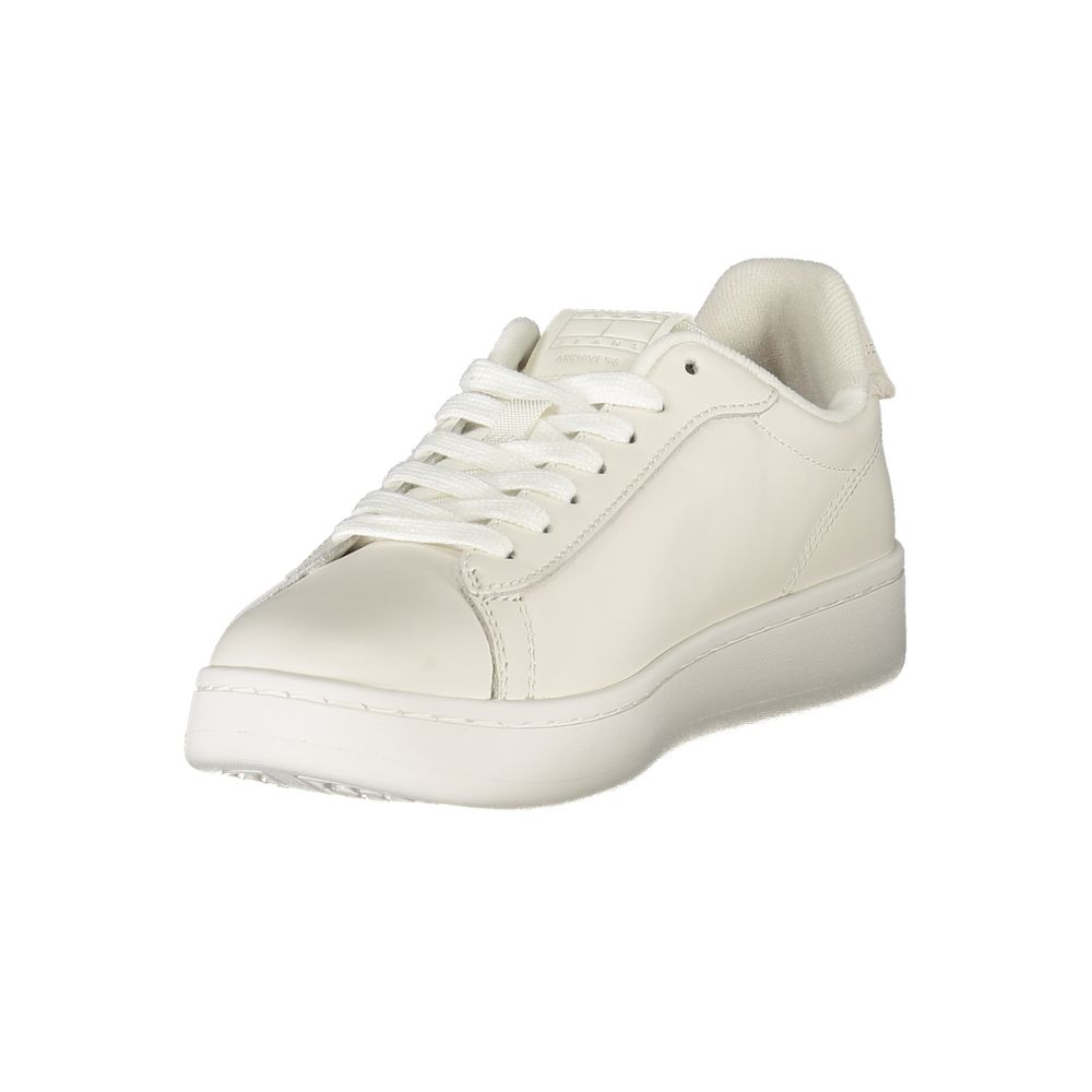 Tommy Hilfiger white polyurethane low-top women's sneaker with matching white laces and flat rubber sole.