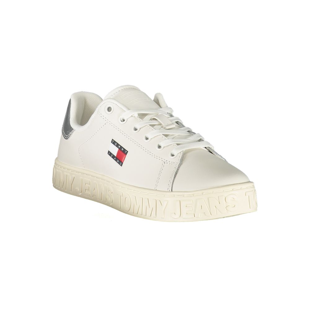 White polyurethane Tommy Hilfiger women's sneaker with lace-up closure, side logo, and embossed branding on the sole.