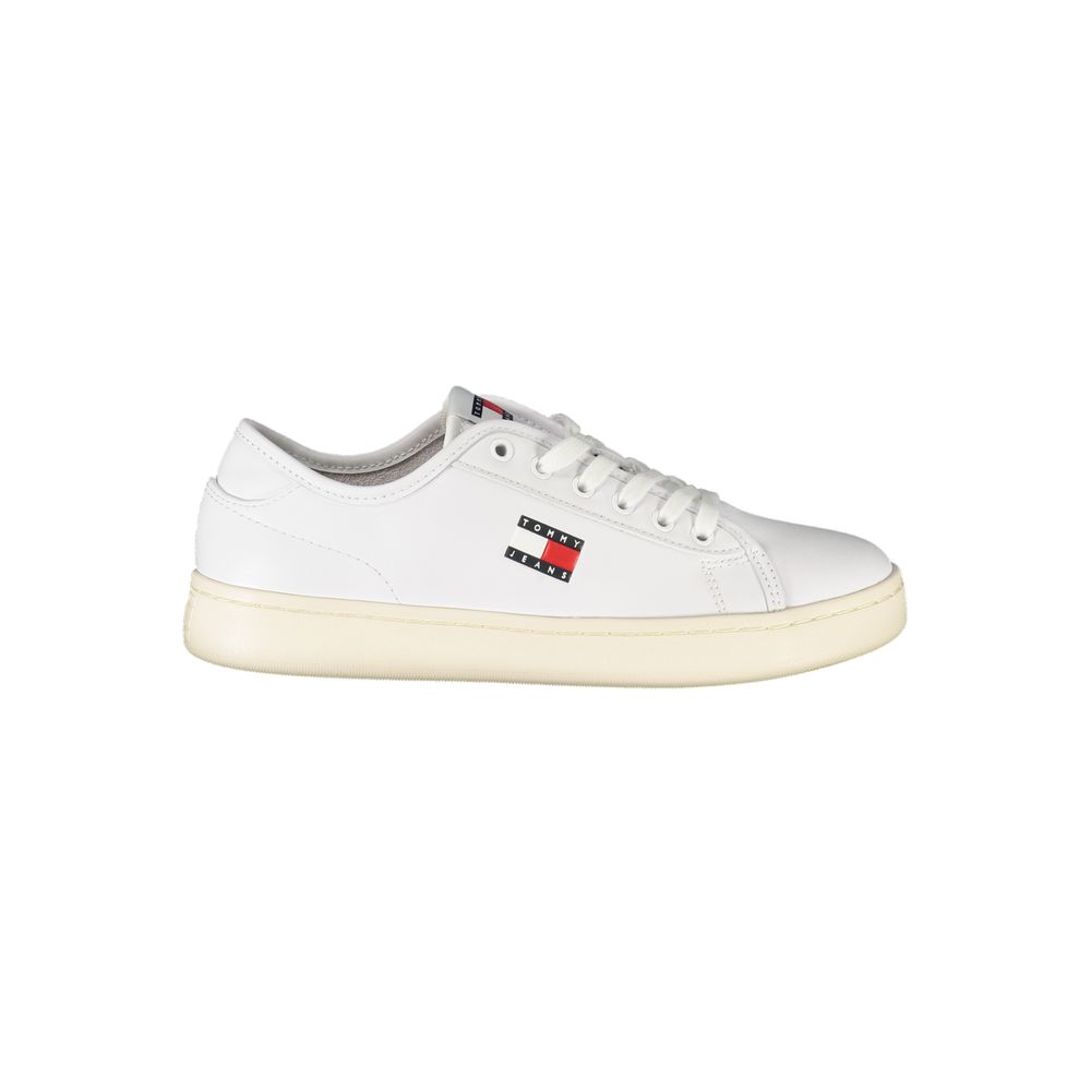 White polyurethane Tommy Hilfiger lace-up sneaker with a cream rubber sole and branded flag logo on the side.