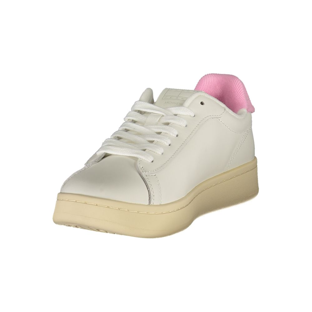 Tommy Hilfiger white polyurethane low-top sneaker with pink fabric heel collar and chunky beige platform sole.