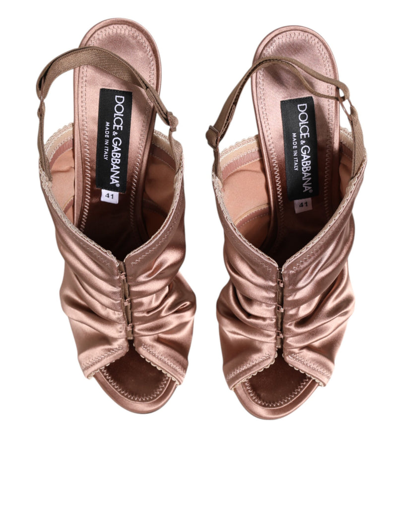 Bronze satin Dolce & Gabbana slingback sandals featuring a ruched upper, open toe, and elasticated heel strap.