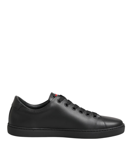 Dolce & Gabbana black leather low-top sneakers with matching laces and a sleek, minimalist silhouette.