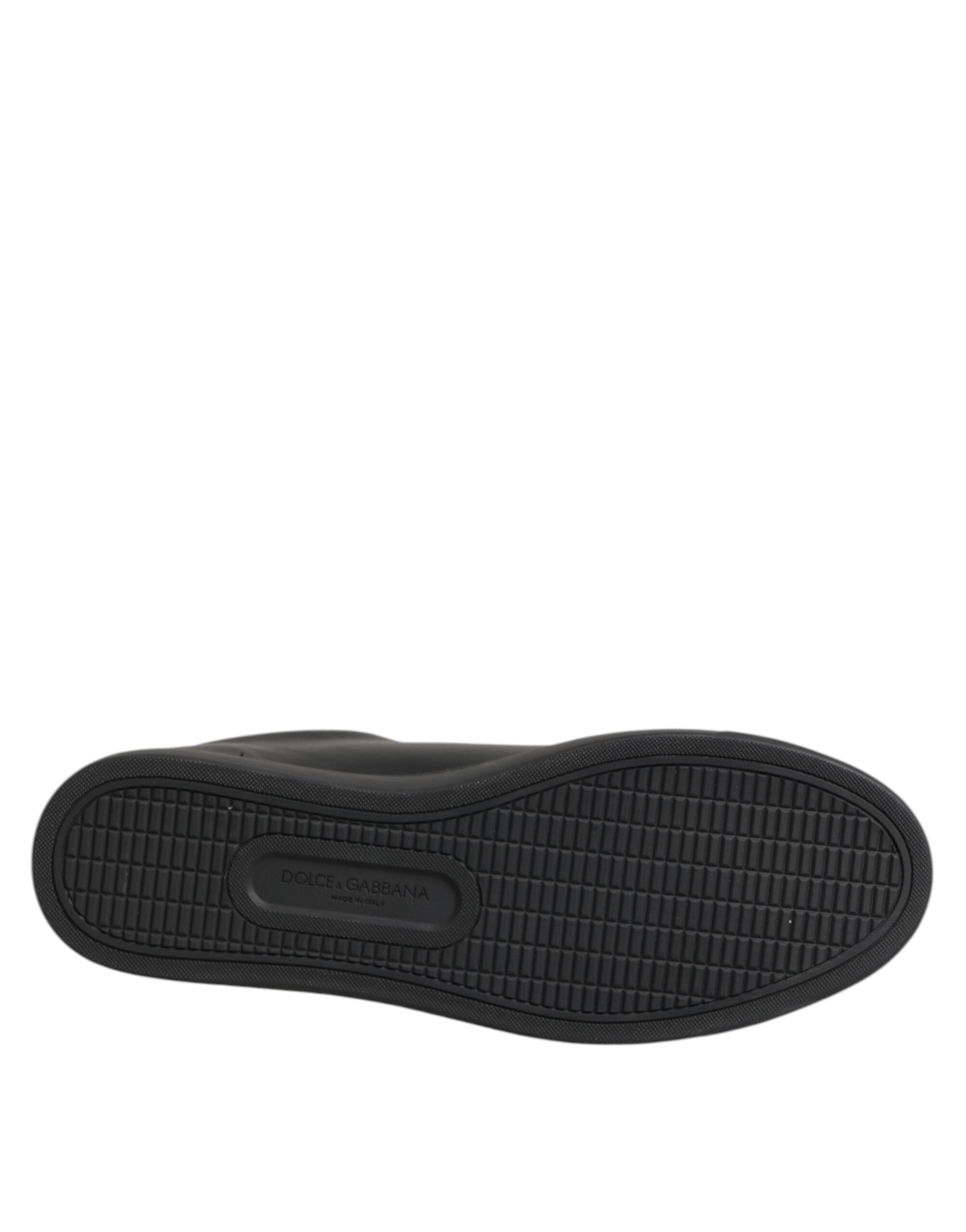 Black rubber sole of a Dolce & Gabbana low-top sneaker featuring a grid-patterned tread and embossed logo.