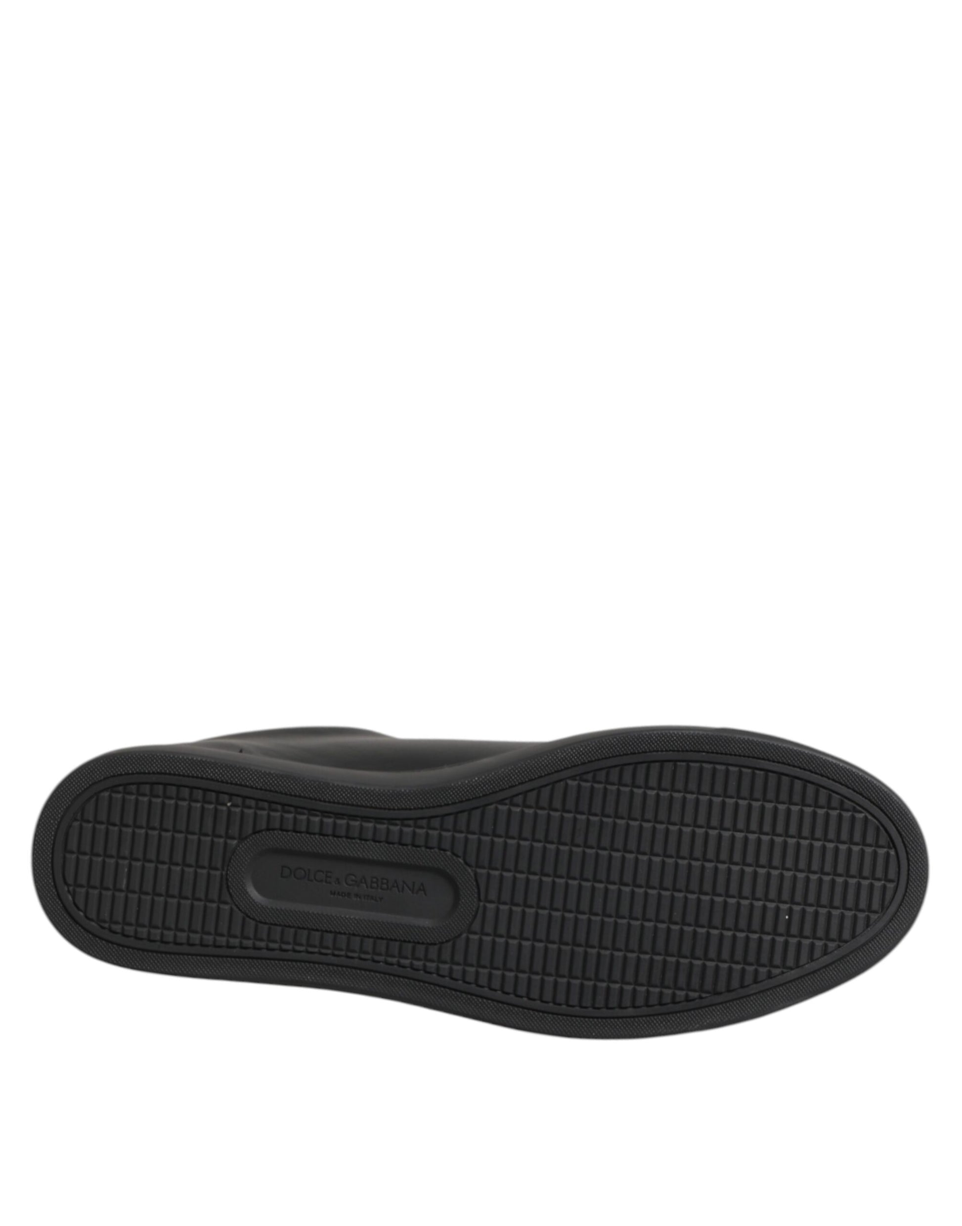 Black rubber sole of a Dolce & Gabbana low-top sneaker featuring a grid-patterned tread and embossed logo.