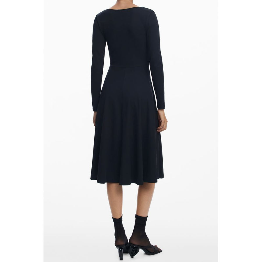 Black long-sleeve cotton dress with square neckline and yellow abstract graphic on flared skirt