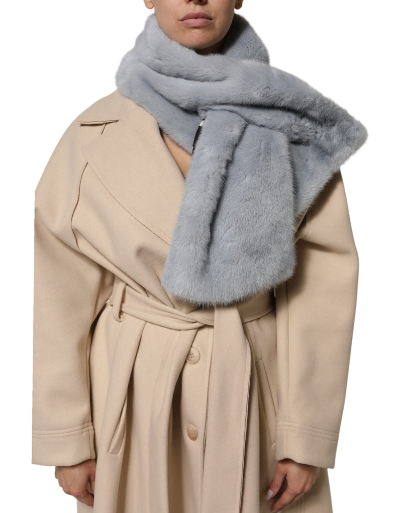 Powder blue mink fur neck warmer scarf worn over a beige coat