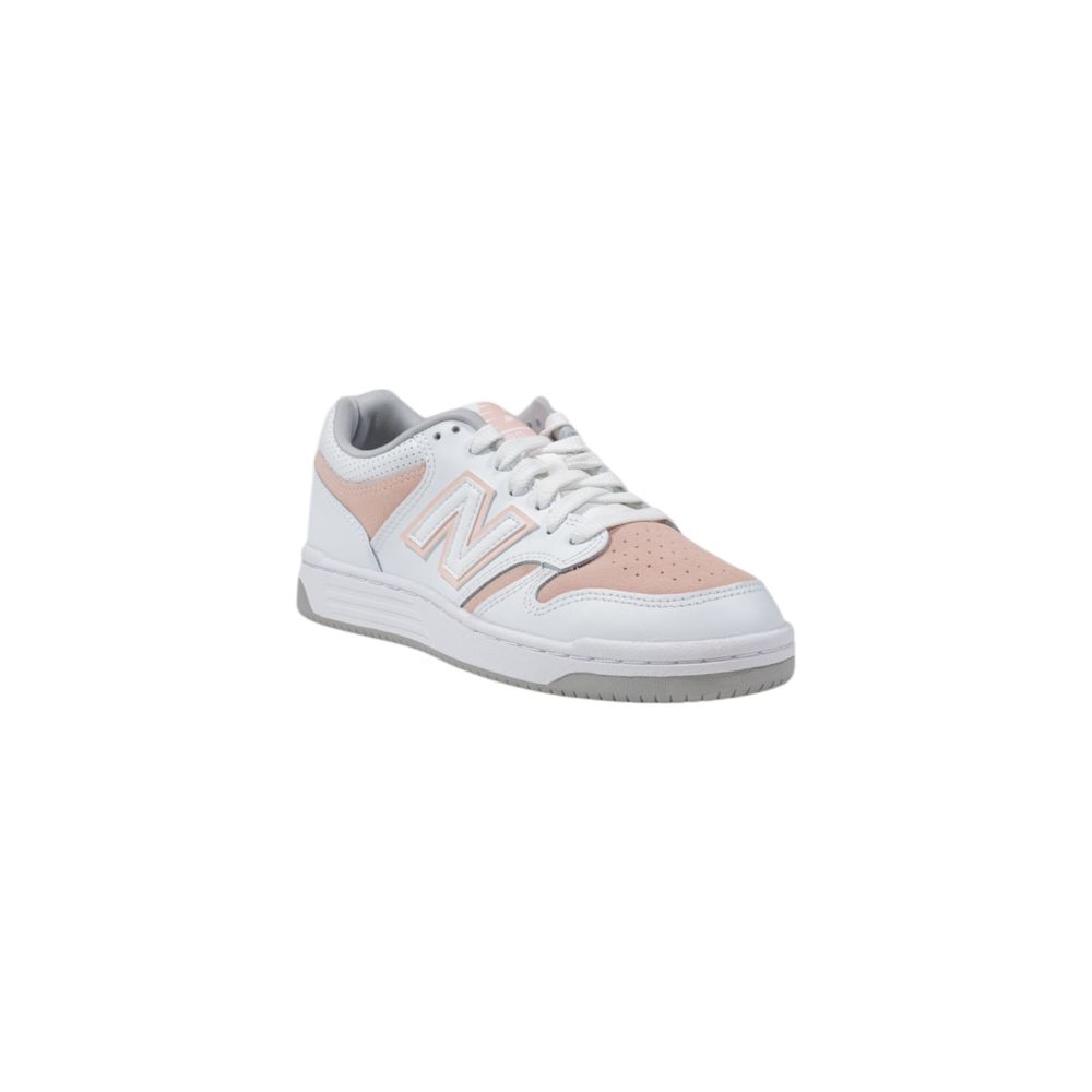 New Balance lifestyle sneakers featuring a white leather upper, pink perforated toe and side panels, and grey accents.