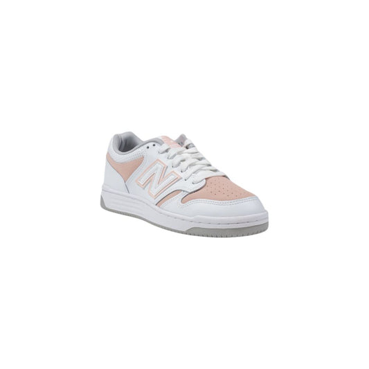 New Balance lifestyle sneakers featuring a white leather upper, pink perforated toe and side panels, and grey accents.