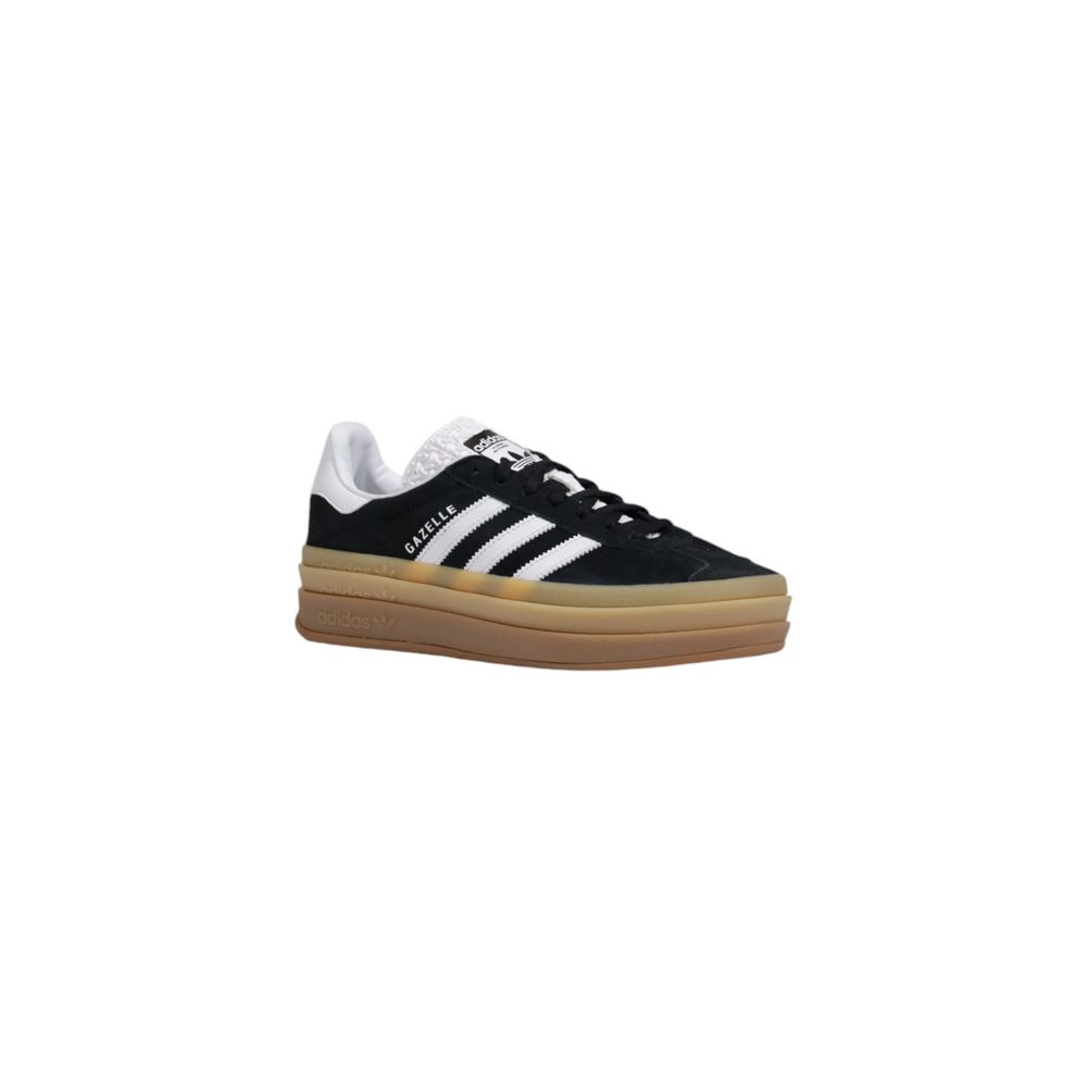 Adidas Originals black suede low-top sneaker with white three-stripes, white heel tab, and stacked gum platform sole.