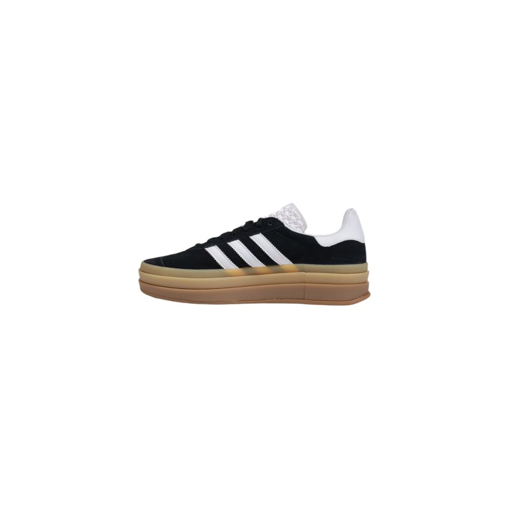 Adidas Originals black suede low-top sneaker with white three-stripes, white heel tab, and stacked tan gum sole.