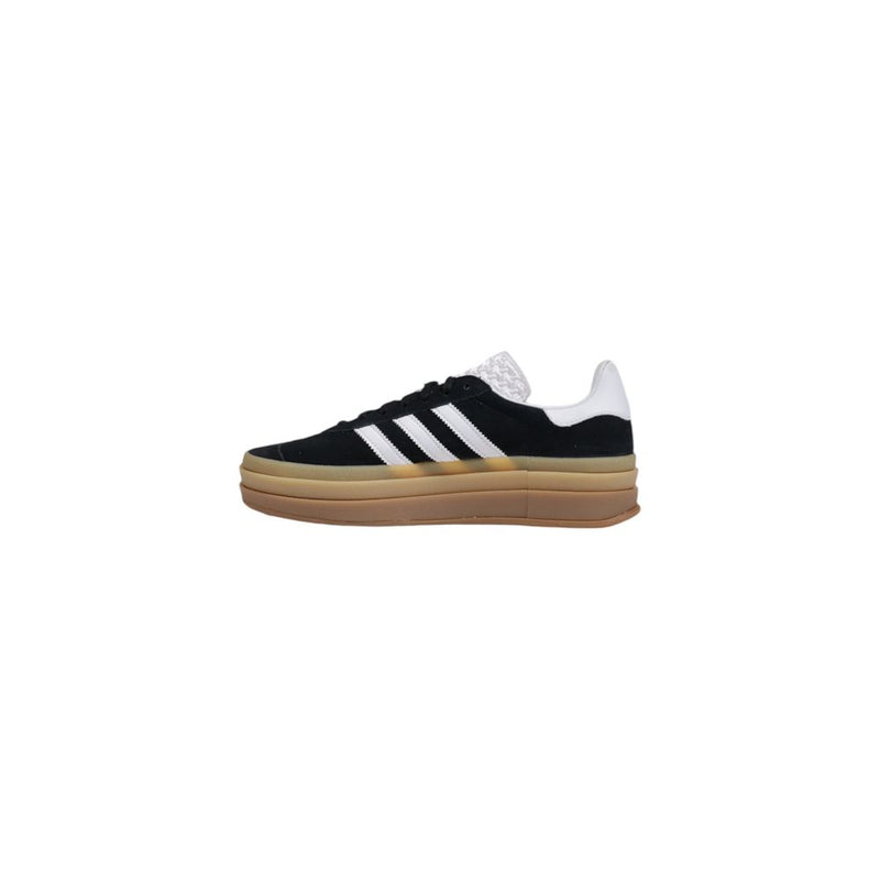 Adidas Originals black suede low-top sneaker with white three-stripes, white heel tab, and stacked tan gum sole.