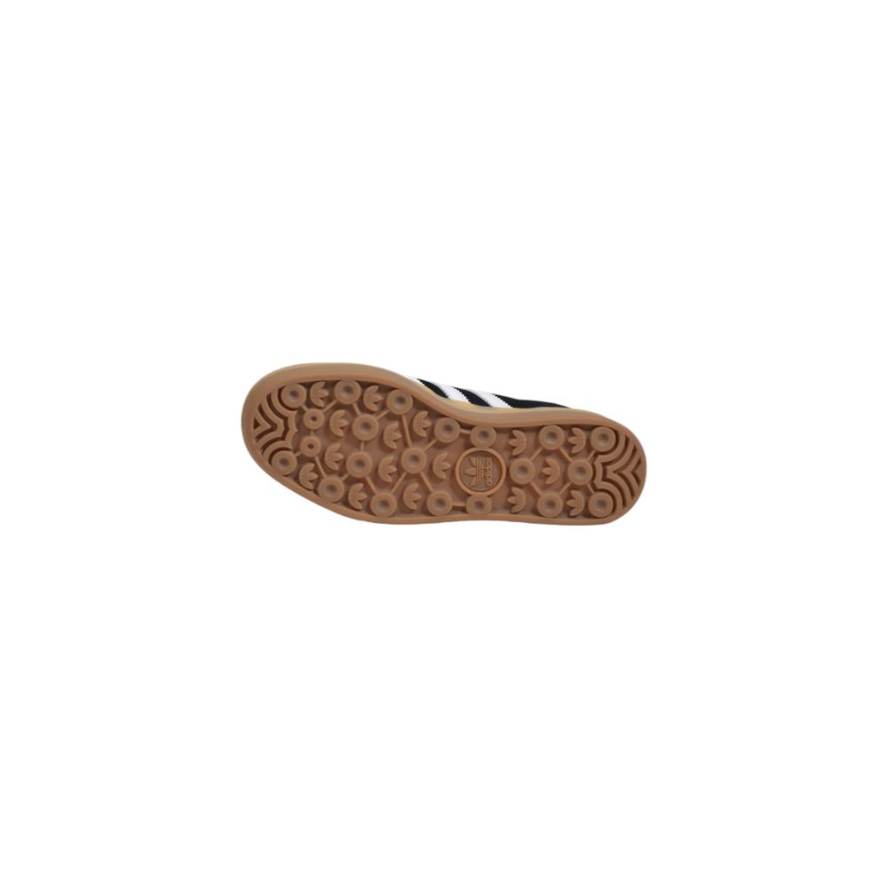 Adidas Originals low-top sneaker featuring a black suede upper and a textured brown gum rubber sole.