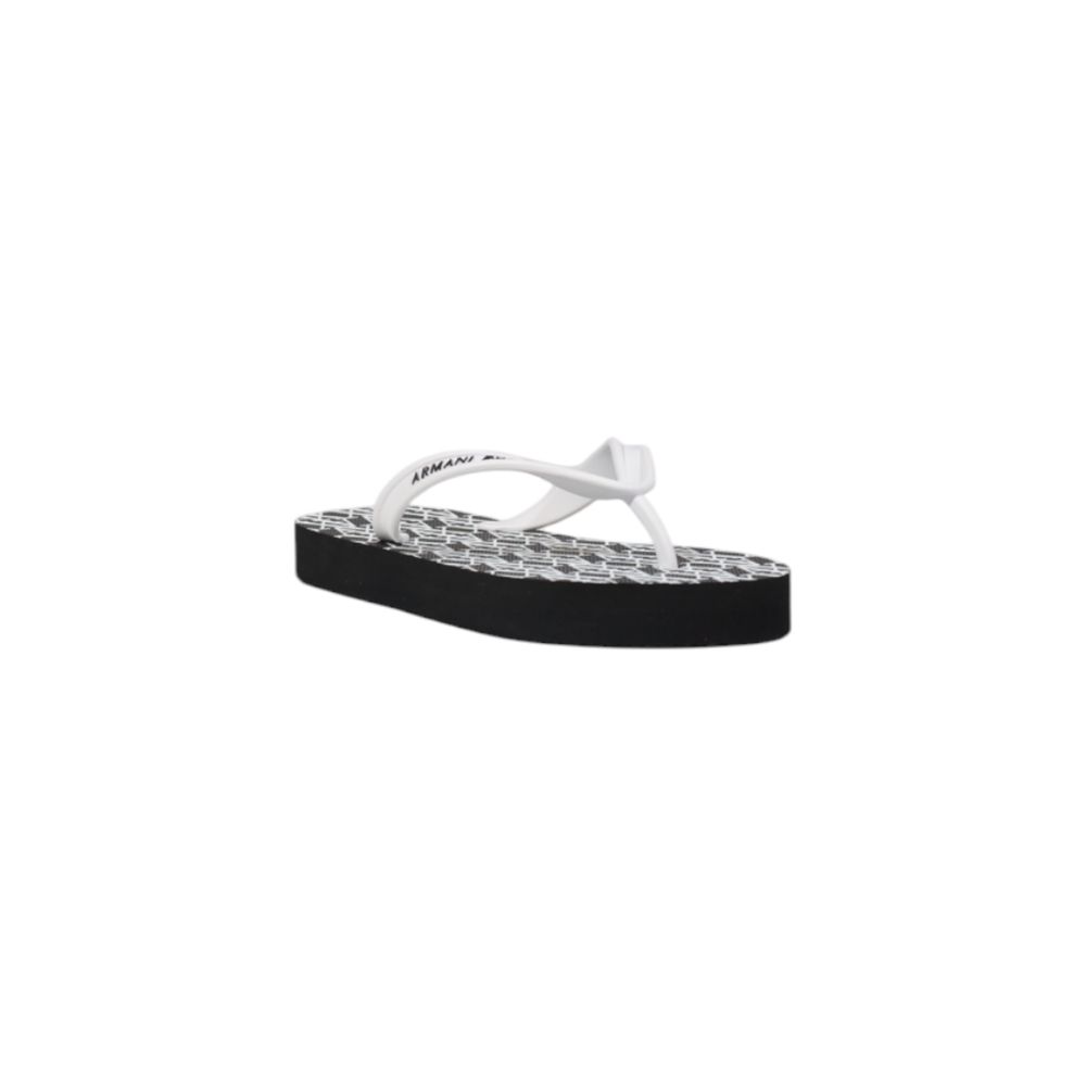 Armani Exchange rubber flip-flops with a white strap, platform sole, and black-and-white patterned footbed.
