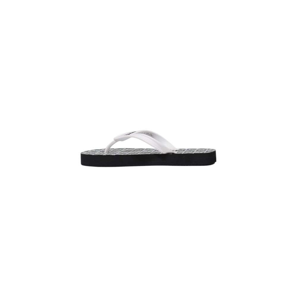 Armani Exchange rubber flip-flops with a white strap and a black footbed featuring a white logo grid pattern.