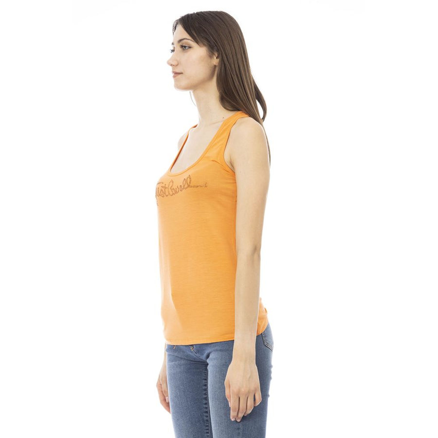 Orange viscose scoop neck tank top with rhinestone logo on chest worn with jeans
