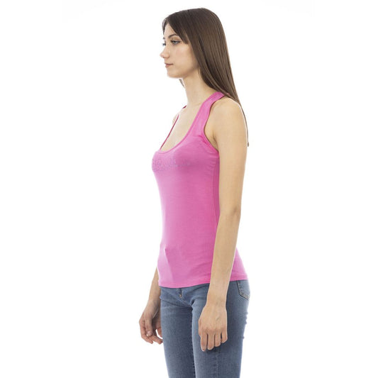 Pink viscose tank top with scoop neck and thin straps worn with jeans