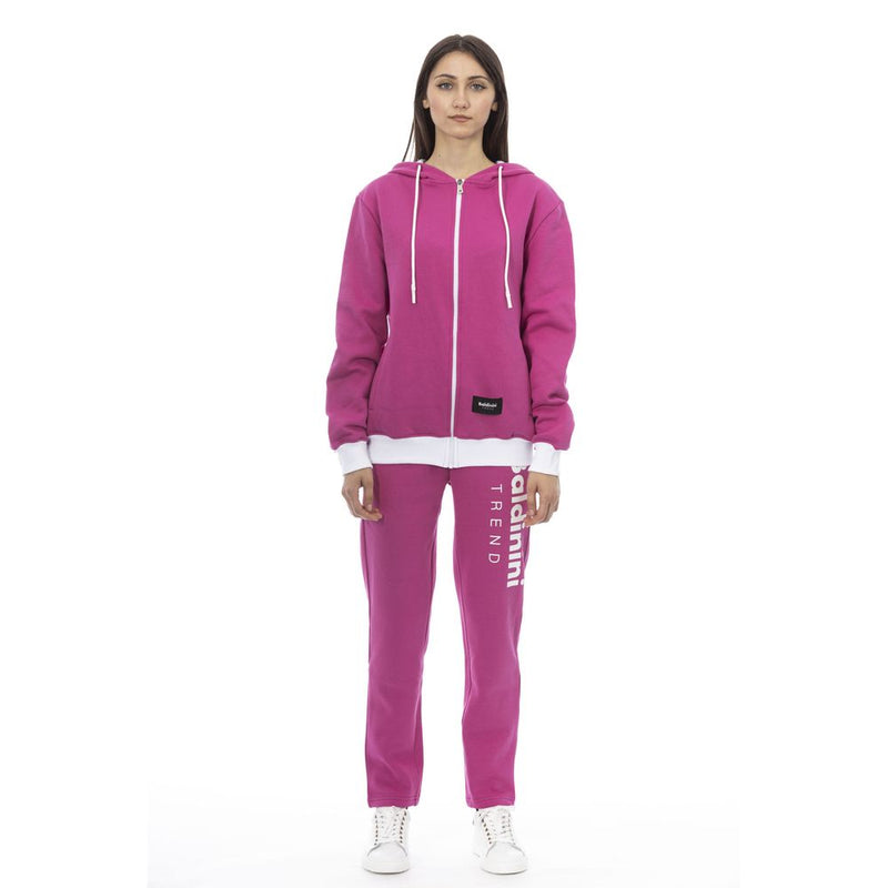Woman wearing magenta cotton zip-up hoodie and matching sweatpants with white trim