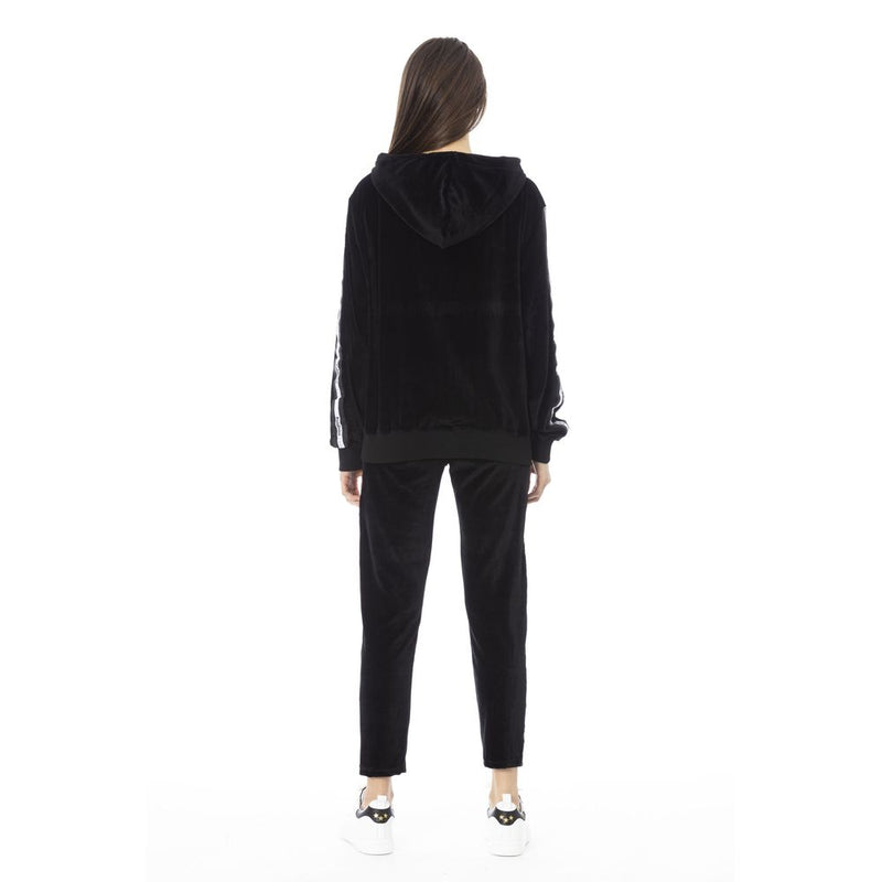 Black velour women's tracksuit with a hooded sweatshirt and matching pants