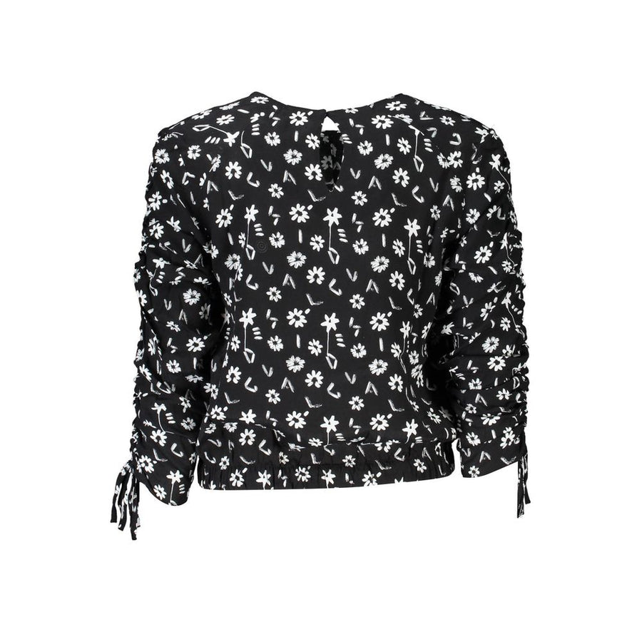 Black viscose blouse with white floral pattern, long sleeves with gathered details and cuffs, and a cinched hemline