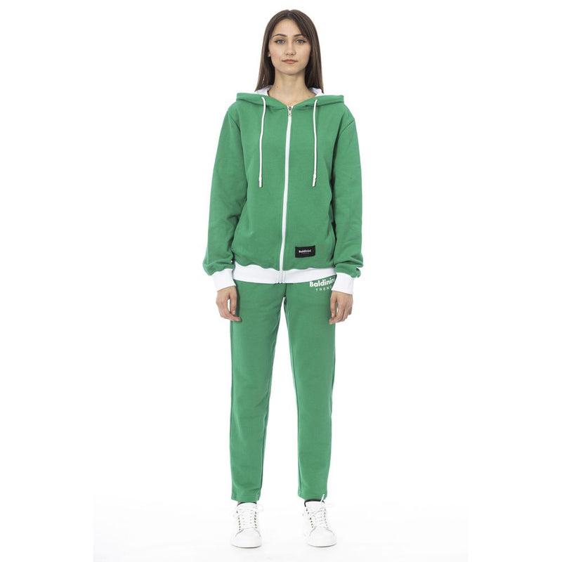 Green cotton zip-up hoodie and matching sweatpants set worn by a woman