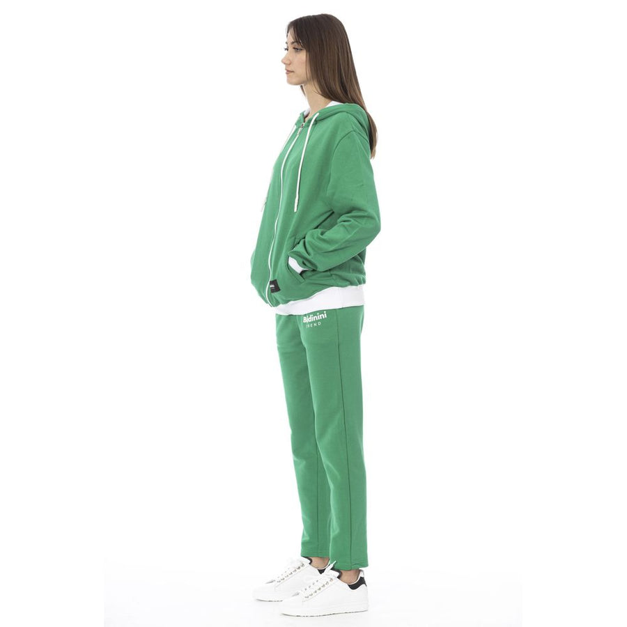 Green cotton zip-up hoodie and matching sweatpants set worn by a woman