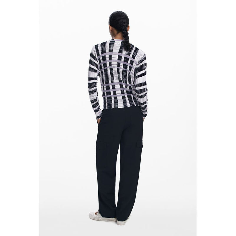 Back view of a woman wearing a black, white, and purple patterned viscose long-sleeve sweater