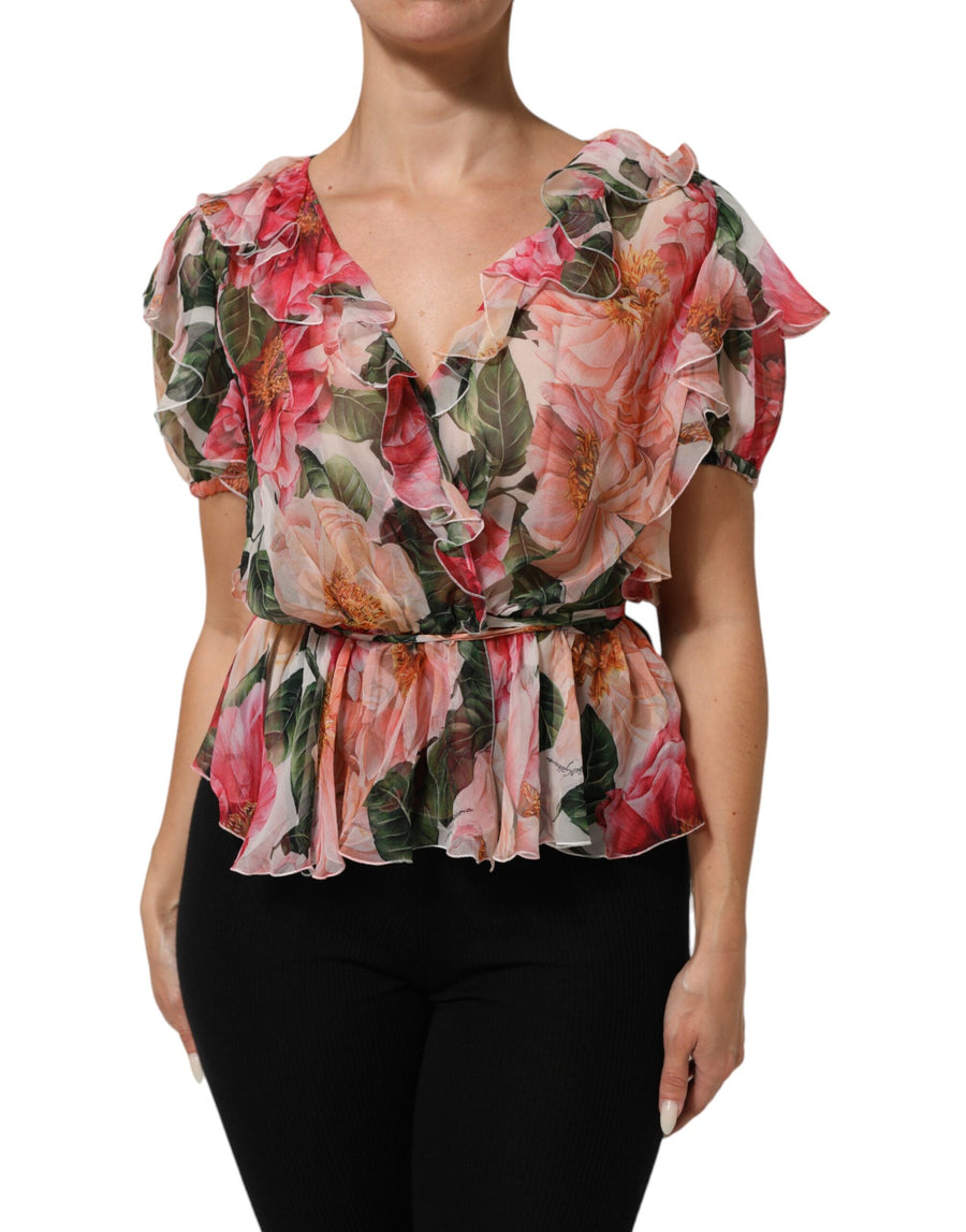 Pink silk V-neck blouse with camellia floral print and ruffled short sleeves