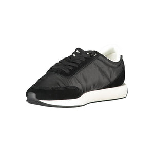 Calvin Klein black polyester women's sneaker with suede overlays and a white rubber sole in a sporty, casual style.