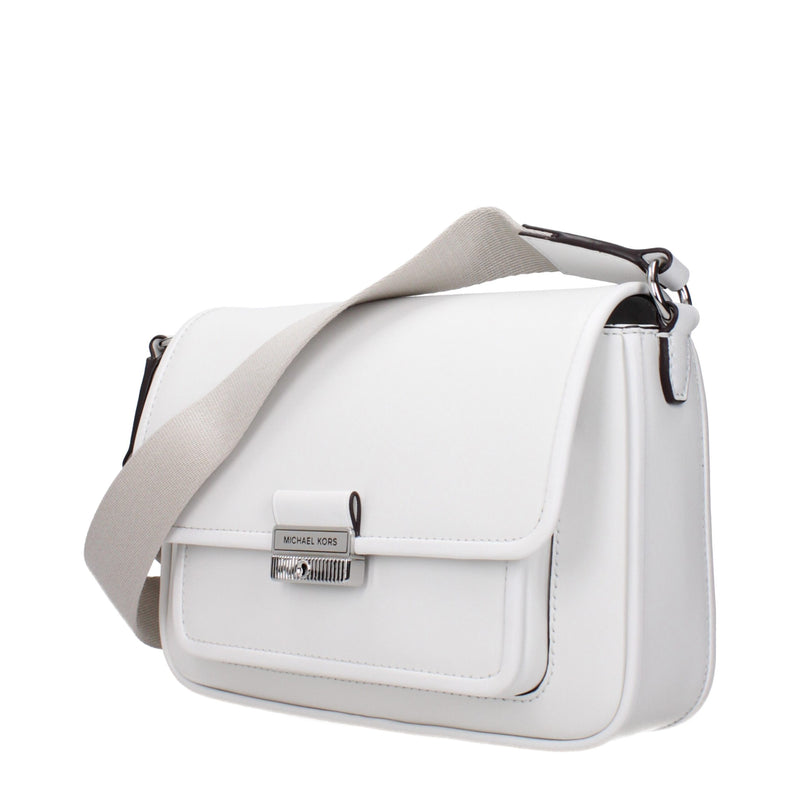 White leather Michael Kors crossbody bag with a wide fabric strap and silver hardware clasp