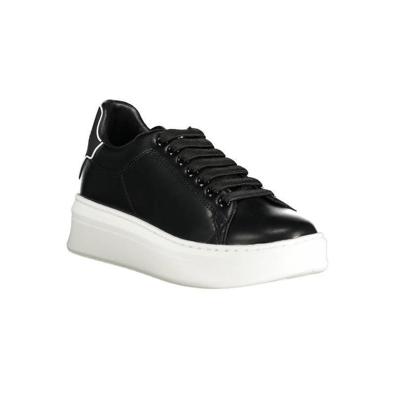 Gaelle Paris black polyurethane low-top platform sneaker with thick white rubber sole and matching black laces.