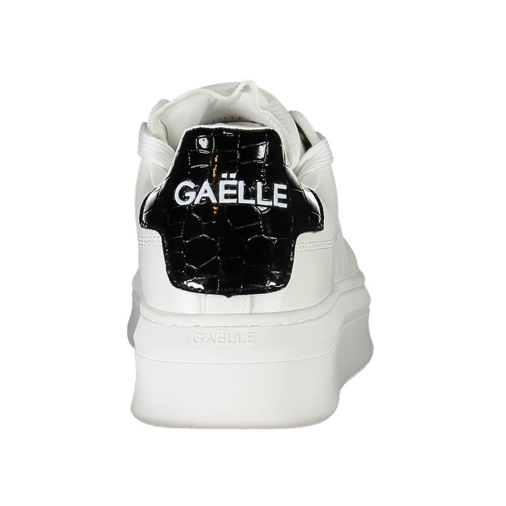 White polyurethane women's sneaker with thick sole and black crocodile-embossed heel patch featuring Gaëlle branding.