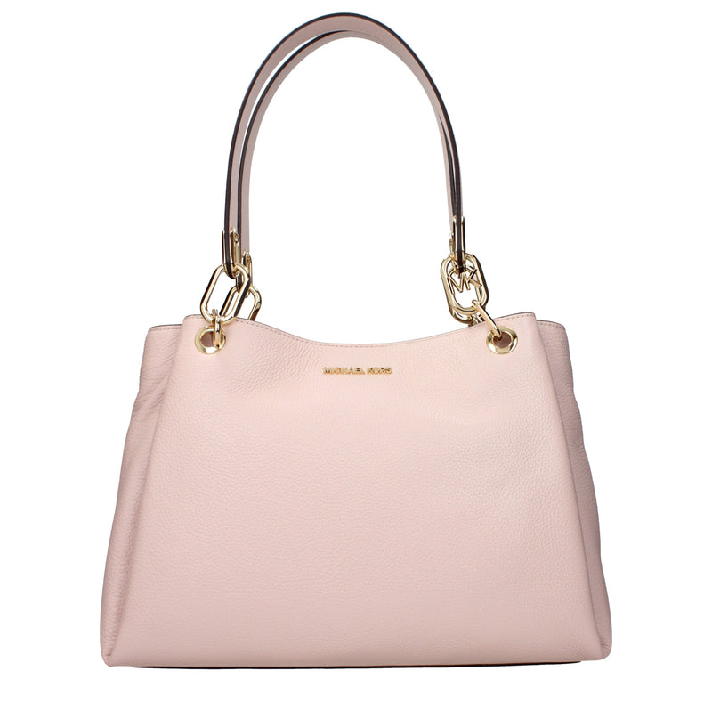 Light pink leather shoulder bag with gold chain accents and top handles