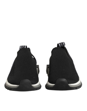 Dolce & Gabbana black slip-on Sorrento low-top sneakers in stretch mesh fabric with branded pull tabs and chunky soles.