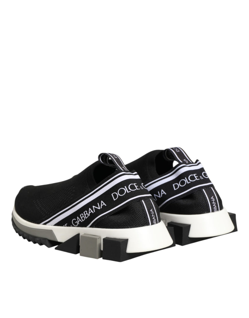 Dolce & Gabbana black stretch mesh slip-on sneakers with logo-branded heel straps and geometric white/black rubber soles.