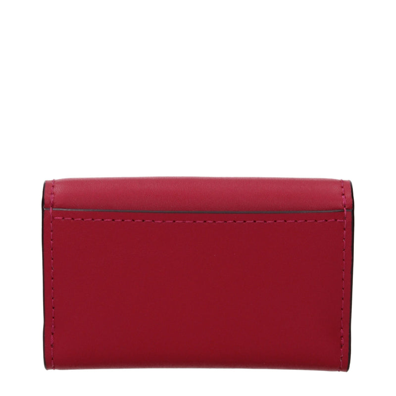 Michael Kors red leather folding wallet with visible stitching